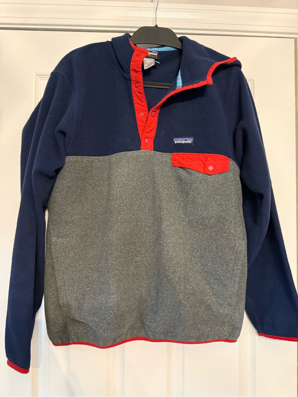 Patagonia Navy Fleece Pullover with Red Trim and Light Blue Accents